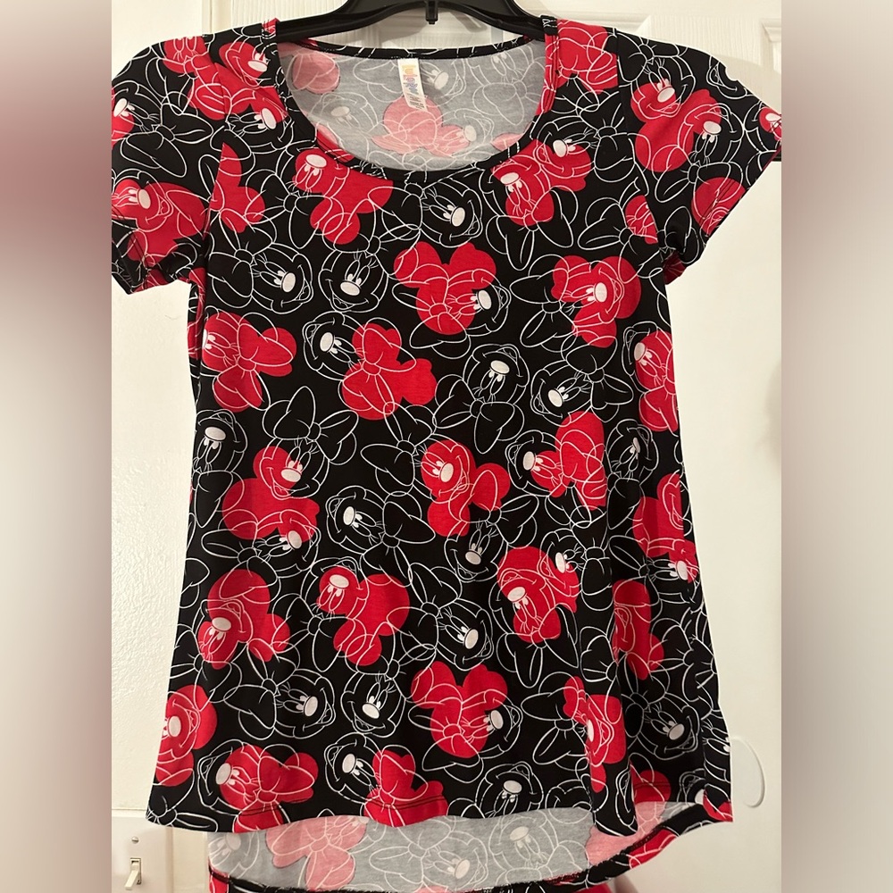 Gently used Lularoe Disney size XXS top. Comes from bug smoke and pet free home.